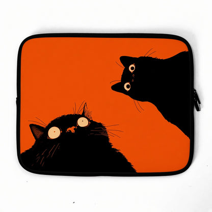 Two Black Cats on a Bright Orange Laptop Sleeve