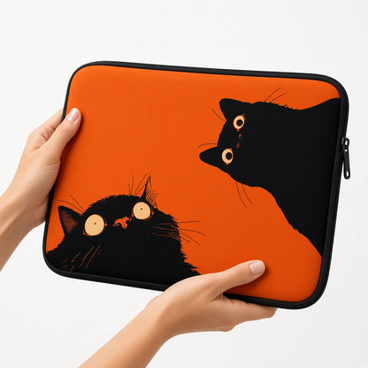 Two Black Cats on a Bright Orange Laptop Sleeve