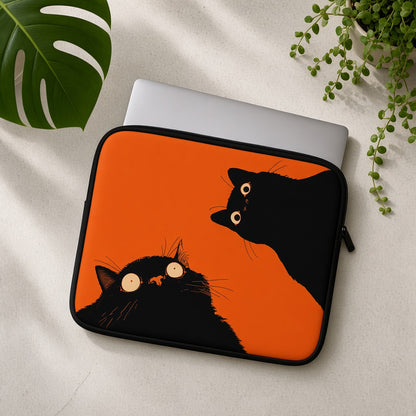 Two Black Cats on a Bright Orange Laptop Sleeve